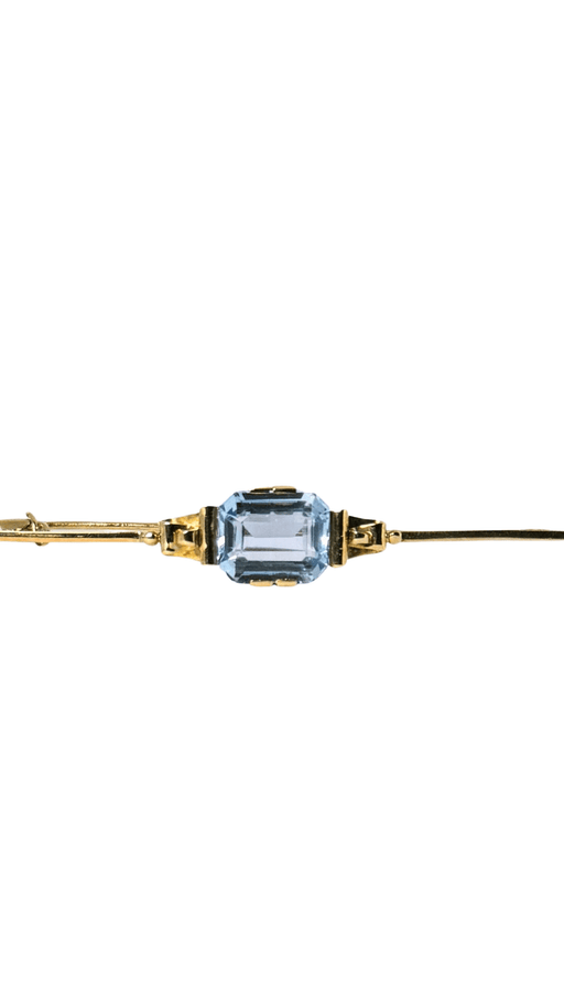 Broche Pin's vintage d'occasion en or 14 carats avec une superbe topaze bleue 58 Facettes 2207041