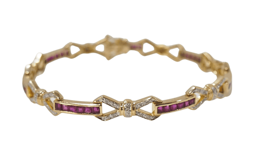 Bracelet Bracelet vintage en or jaune, rubis calibrés et diamants 58 Facettes 31672