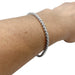 Bracelet Bracelet ligne Cartier "C de Cartier" en or blanc et diamants. 58 Facettes 30089
