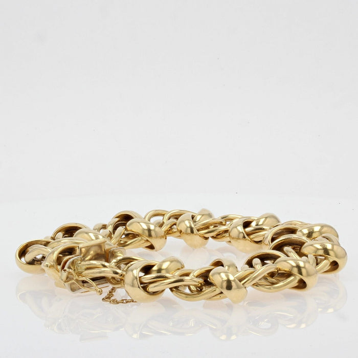 Bracelet Bracelet gourmette en or jaune aux motifs entrelacés 58 Facettes DV2109