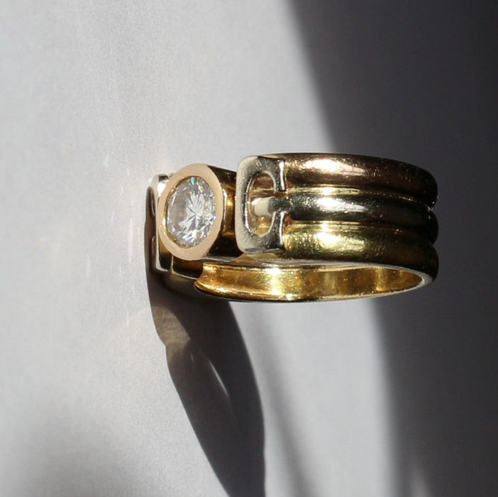 Three Gold ring set with a diamond