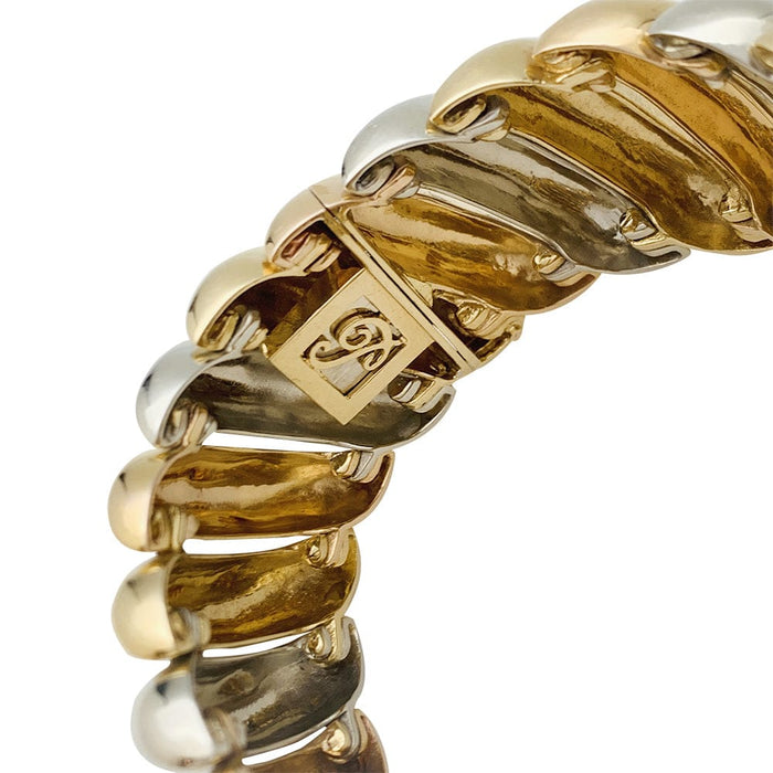 Bracelet Poiray en trois tons d'or.