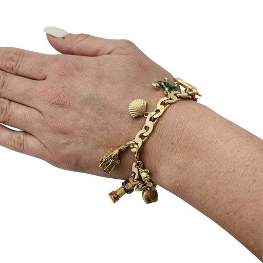 Bracelet Bracelet breloques en or jaune, émail et saphir. 58 Facettes 30179