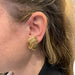 Boucles d'oreilles Boucles d'oreilles Cartier "Noeuds" en or jaune. 58 Facettes 30137