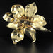 Brooch Flower brooch in gold and orange garnet cabochon 58 Facettes 13-002-7296526