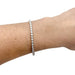 Bracelet Bracelet ligne Cartier "C de Cartier" en or blanc et diamants. 58 Facettes 30089
