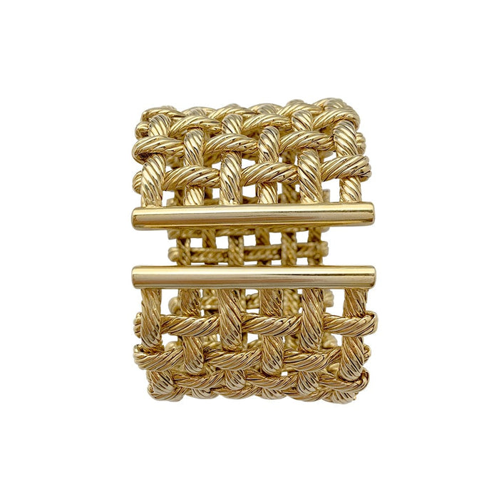 Bracelet Manchette Hermès en or jaune.