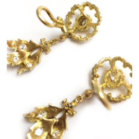 Yellow gold Buccellati earrings and diamonds.