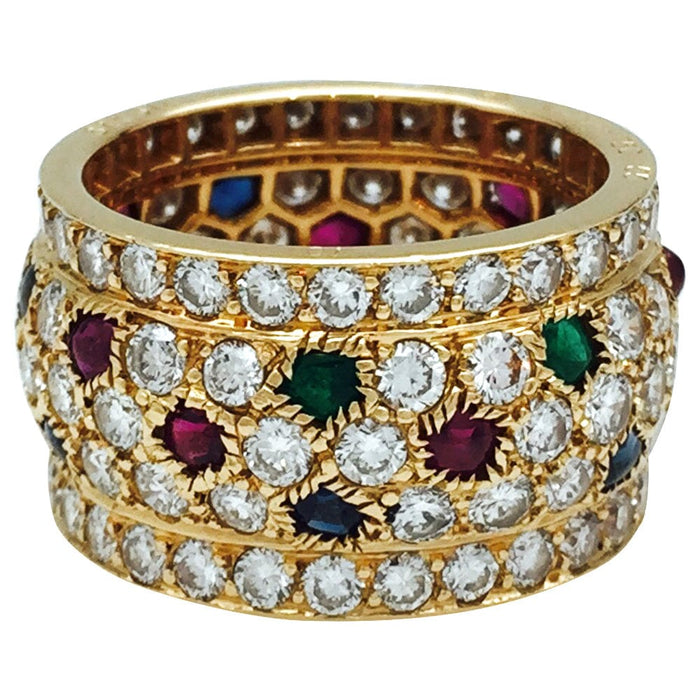Bague 55 Bague Cartier, modèle Nigeria, en or jaune, diamants, rubis, saphirs et émeraudes. 58 Facettes 30384