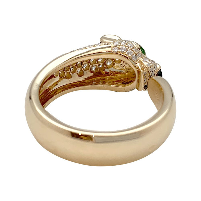 Bague Cartier modèle "Panthère" en or jaune, onyx, émeraudes et diamants.