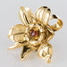 Brooch Flower brooch in gold and orange garnet cabochon 58 Facettes 13-002-7296526