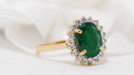 Ring Yellow gold daisy ring with oval emerald and diamonds 58 Facettes 30768