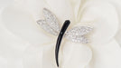 Brooch Dragonfly brooch with diamonds and onyx 58 Facettes 32162