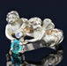 Ring 53 Old ring with emerald and diamond cherubs 58 Facettes 21-581