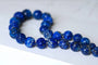 Collier Collier perles de lapis lazuli sculptées 58 Facettes