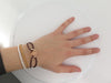 LOUIS VUITTON heart flower monogram bracelet bracelet in 18k rose gold on cord 58 Facettes 249782