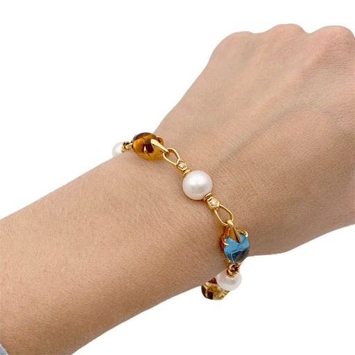 Bracelet Bracelet Bulgari en or jaune, perles, pierres de couleur. 58 Facettes 33083