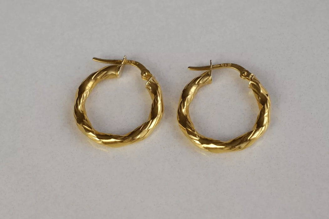 Boucles d'oreilles Paire de créoles torsadées 58 Facettes Ref1640