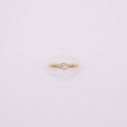 Bague Solitaire en or jaune et diamant serti clos 58 Facettes