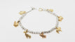 Bracelet 19cm Bracelet breloques Dodo en or jaune et argent 58 Facettes 25557