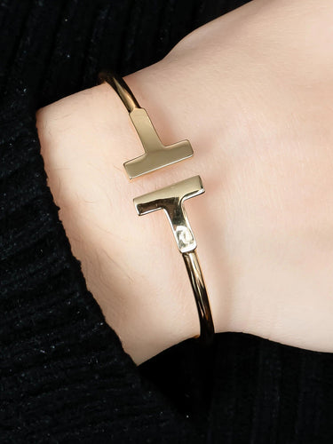 Bracelet Or Jaune BRACELET JONC "T" OR 58 Facettes BO/220032