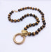 Necklace Gold and tiger's eye necklace 58 Facettes