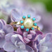 Bague 54 Bague or rose perle de culture et perles de turquoise 58 Facettes 19-635