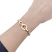 Cartier “Agrafe” bracelet in yellow gold. 58 Facettes 33477