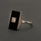 Bague Bague Art Déco en or gris, onyx et diamant "Blink" 58 Facettes 1966