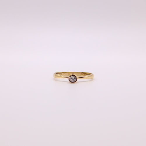 Bague Solitaire en or jaune et diamant serti clos 58 Facettes
