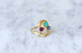 Ring Snake and clover ring, Sapphire, Emerald, Garnet 58 Facettes