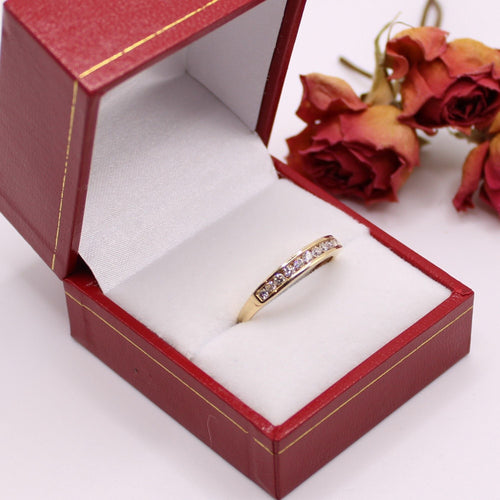 Bague Alliance demi-tour or jaune et diamants serti rail 58 Facettes