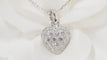 Collier Collier Cartier pendentif cœur, or blanc et diamants 58 Facettes 13807