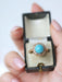 Bague Bague Marguerite turquoise entourage diamants 58 Facettes