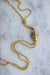 Old chain necklace, neglected yellow gold and pompoms 58 Facettes
