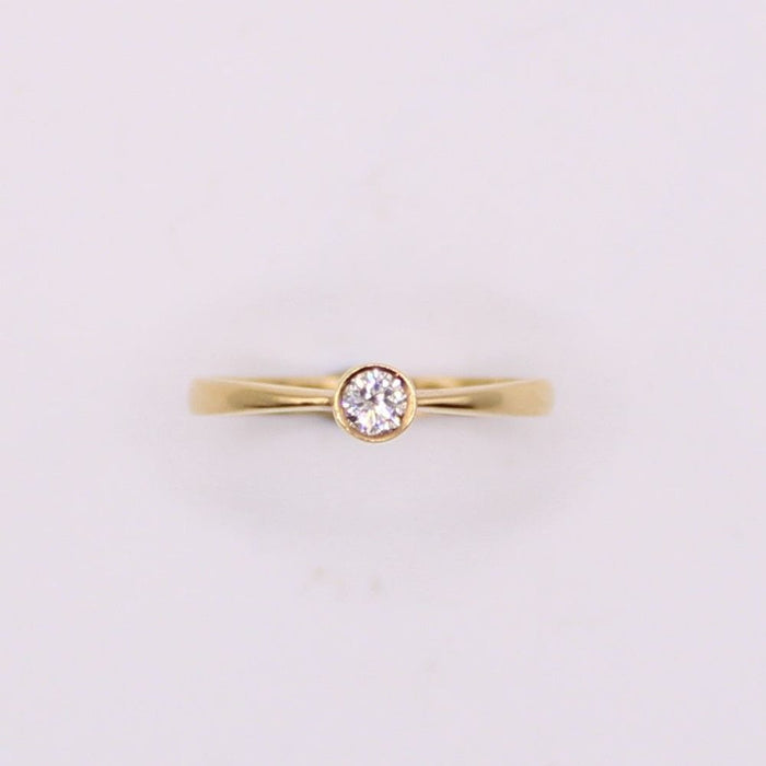 Bague Solitaire en or jaune et diamant serti clos 58 Facettes