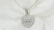 Collier Collier Cartier pendentif cœur, or blanc et diamants 58 Facettes 13807