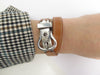 HERMES bracelet bracelet saddle buckle in 925 silver double tour swift leather 17-18 58 Facettes 256586