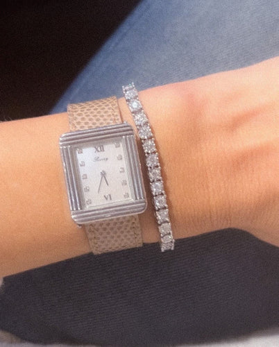 Bracelet Bracelet rivière et or gris orné de diamant 58 Facettes 1