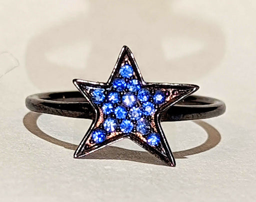 Bague Bague étoile DJULA en or noir et saphirs bleus 58 Facettes