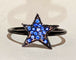 Bague Bague étoile DJULA en or noir et saphirs bleus 58 Facettes