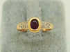 Ring 51 Ring in yellow gold, diamonds, rubies 58 Facettes