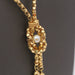 Yellow gold flocking necklace and pearls 58 Facettes E359391
