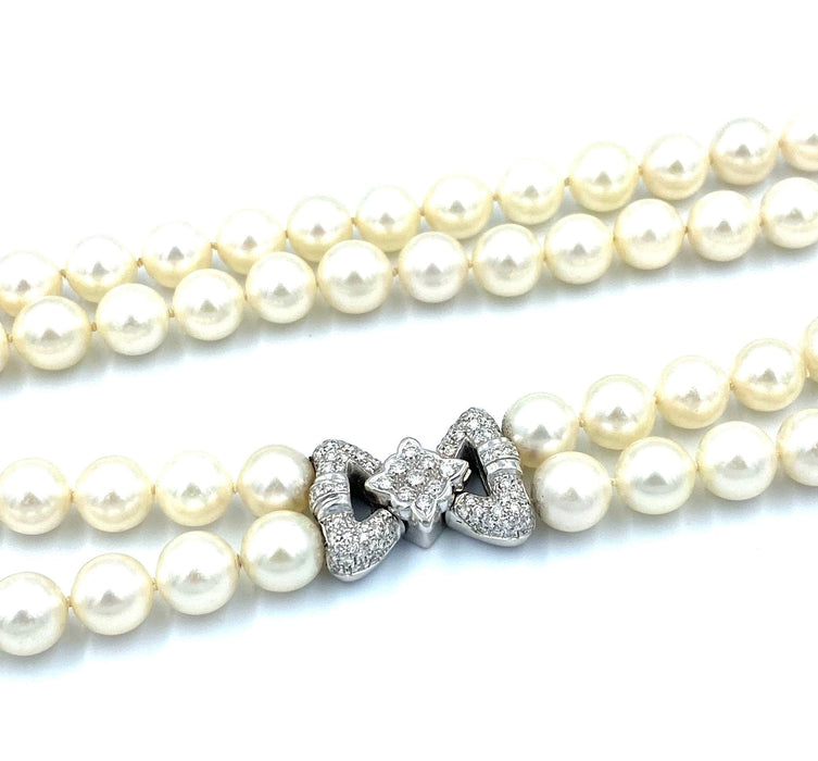 Collier Bucherer. Important collier double rangs perles et diamants 58 Facettes
