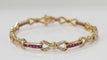 Bracelet Bracelet vintage en or jaune, rubis calibrés et diamants 58 Facettes 31672
