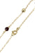 GOLD AND GARNET BALL BRACELET Bracelet 58 Facettes 038571