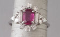 Ring 57 White gold ring, fine ruby ​​in the center and Princess diamond surround 58 Facettes