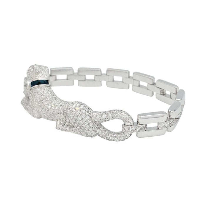 Bracelet Bracelet Cartier "Panthère de Cartier" en or blanc, diamants, émeraude et onyx. 58 Facettes 31544