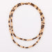 Long necklace in sandblasted yellow gold and tiger's eye pearl 58 Facettes