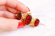 Brooch Old brooch in pomponne and red stones 58 Facettes